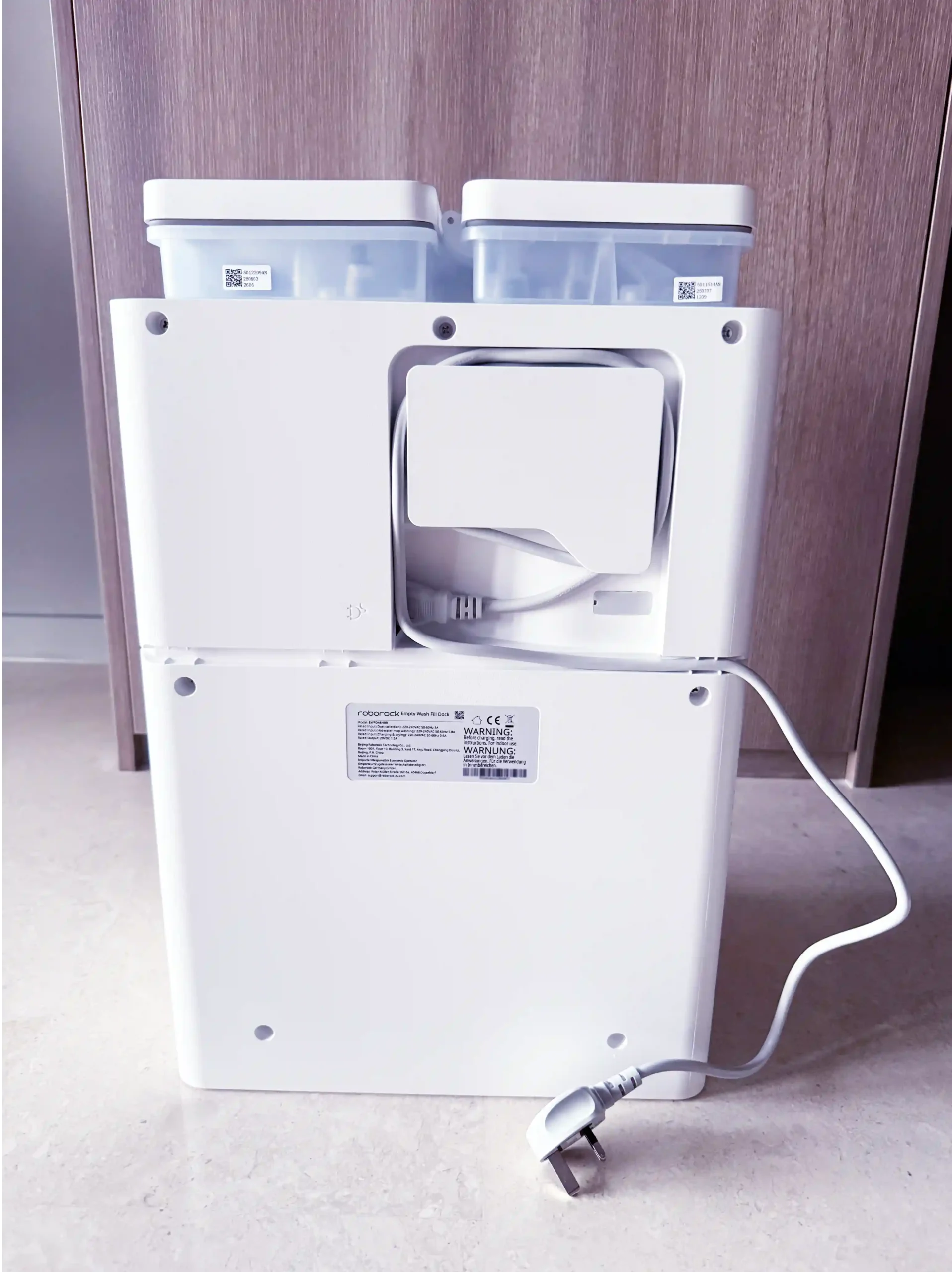 Roborock Qrevo C Pro docking station rear provides a cord wrap hook and cable routing channels to keep the power cord neat and tidy