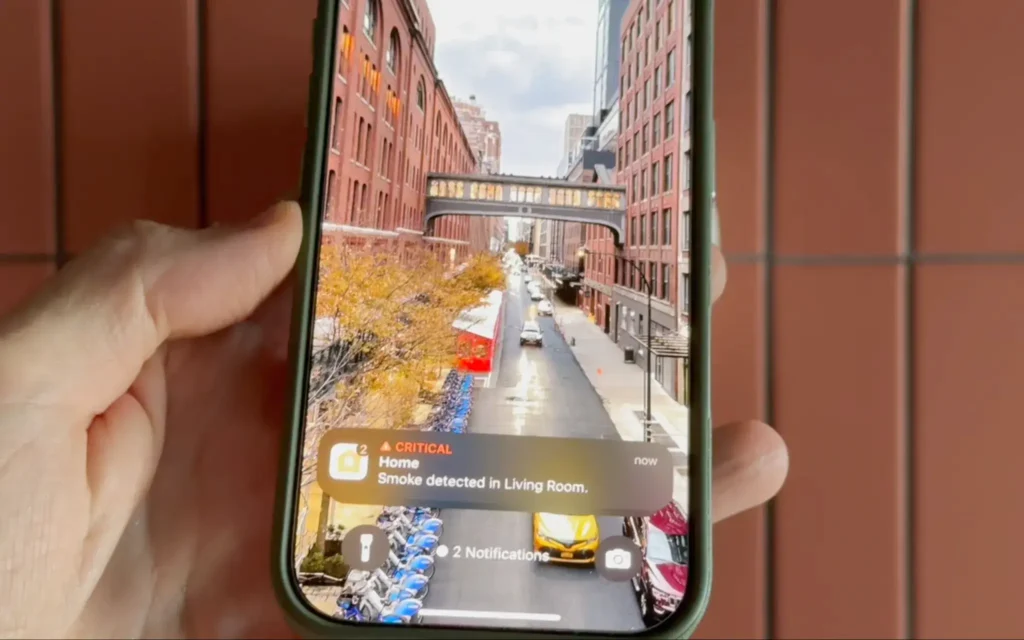 iPhone displaying the Apple Home critical alert when smoke is detected